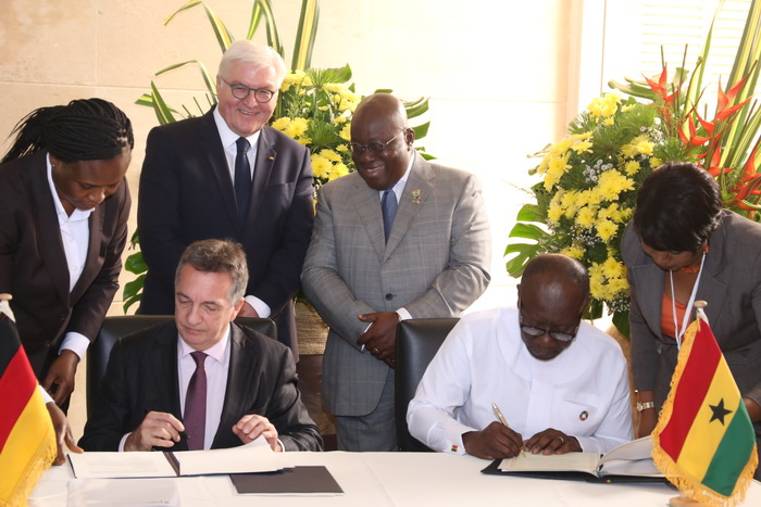Mr Friedrich Kitschelt, the German Deputy Minister for Economic Cooperation, and Mr Ken Ofori-Atta signing the deal between the two countries. With them are President Akufo-Addo and  Mr Frank-Walter Steinmeier, the President of the Federal Republic of Germany.